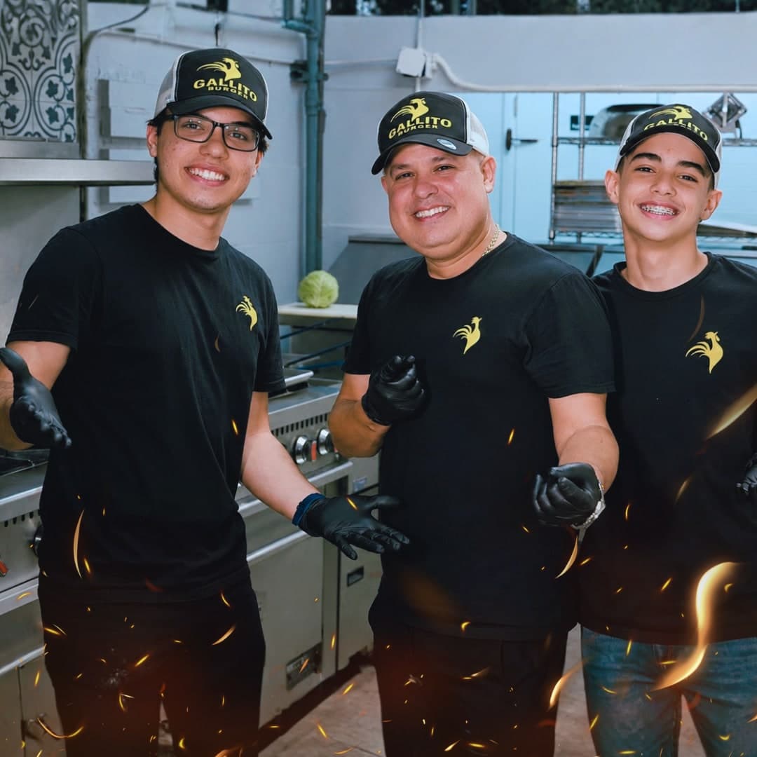 The Gallito Burger team smiling in the commercial kitchen